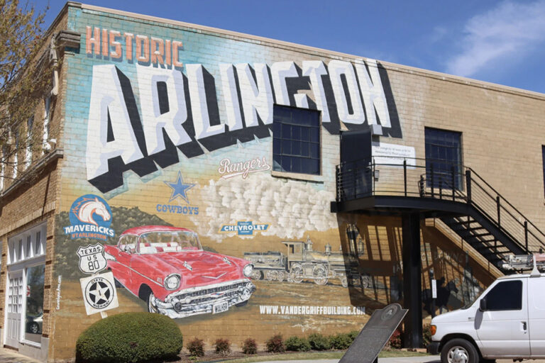 Exterior of the Vandergriff Building facing mural of Arlington's history.