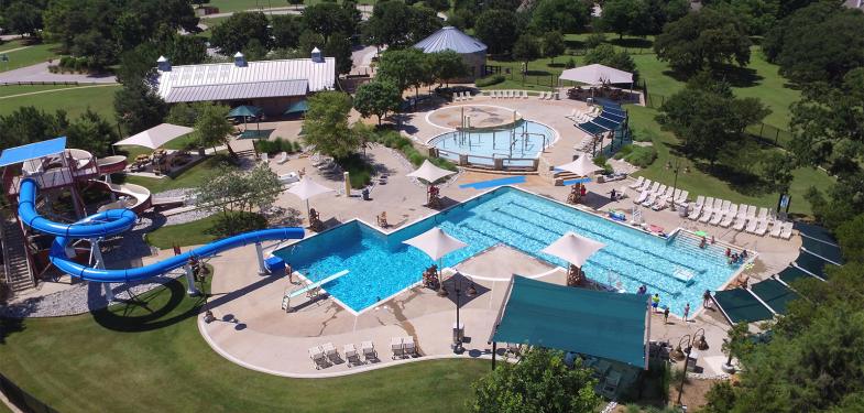 Slides, pools splash pads, chair seen from an aerial view.