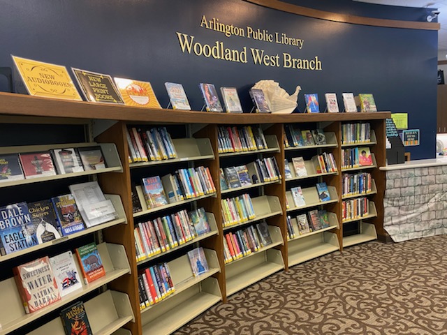 Books on shelves at Woodland West Branch.