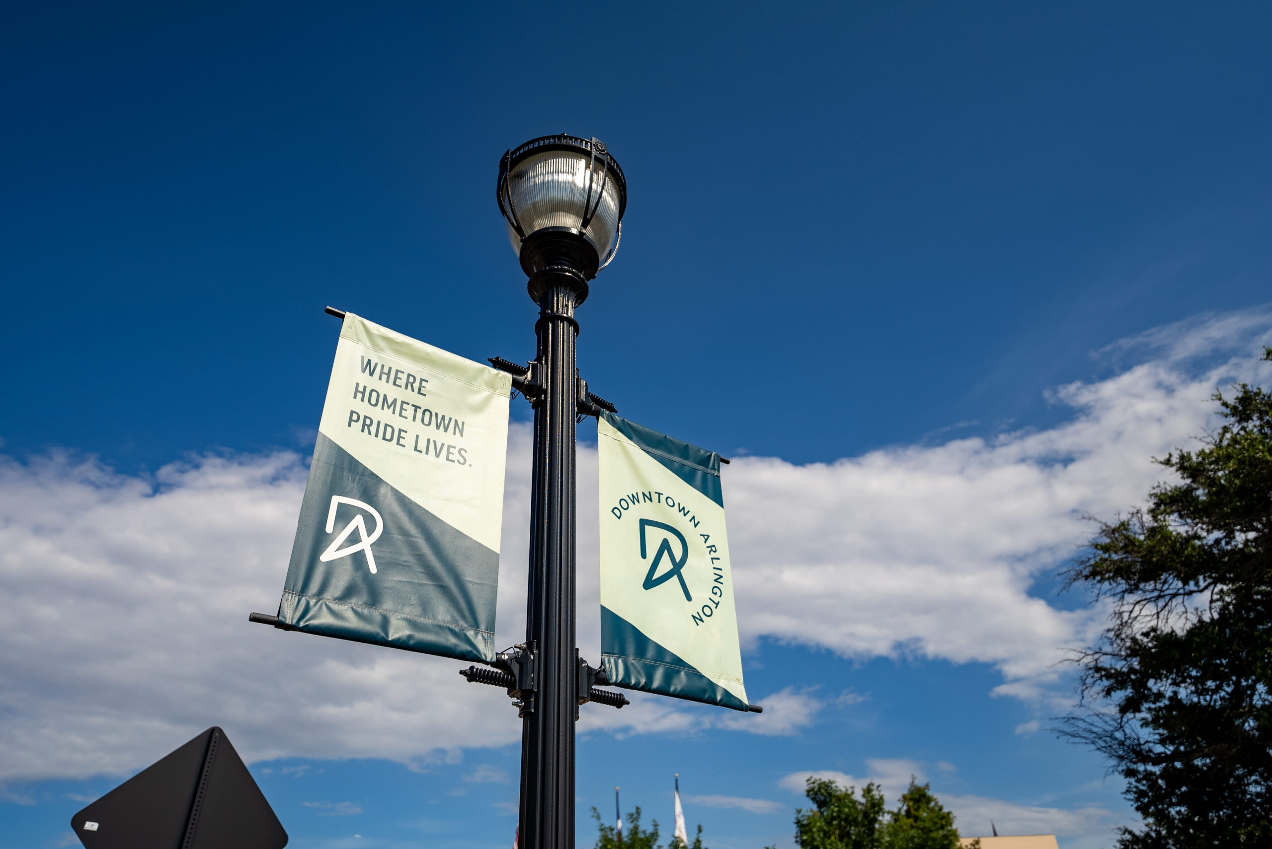 Banners with the Downtown Arlington logo with text that reads, "Where Hometown Pride Lives."