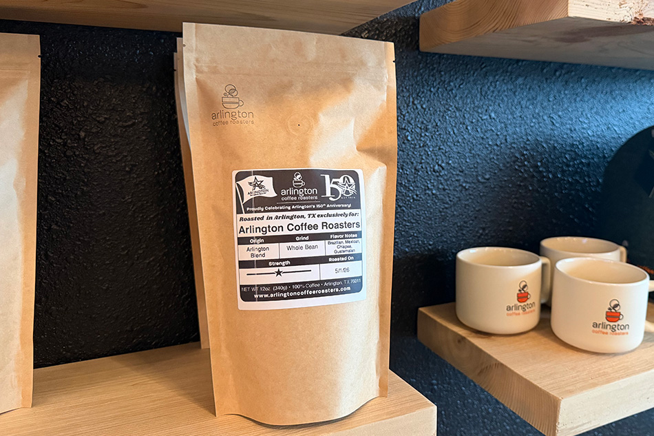 Brown package of coffee beans with "Arlington Coffee Roasters" written on it
