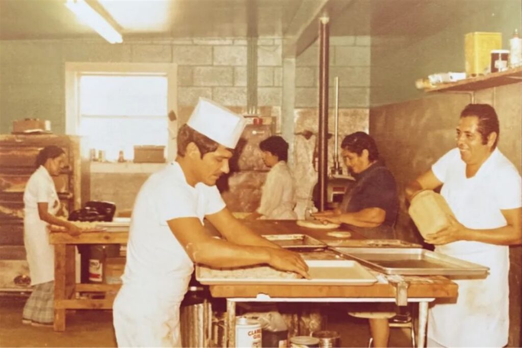 Workers prepping ingredients to bake.