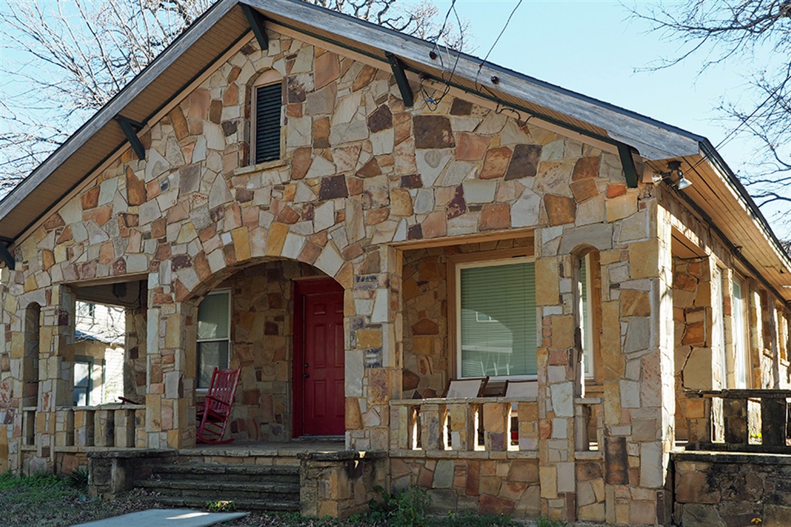 Front porch of a sandstone home seen in Arlington.