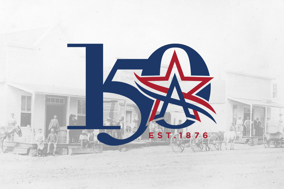 Arlington's 150th logo with the first three businesses in Arlington from 1876 in the background.