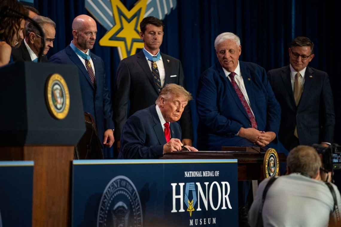 President Donald J. Trump signs the the Hershel “Woody” Williams National Medal of Honor Monument Location Act into law during a ceremony at the National Medal of Honor Museum.